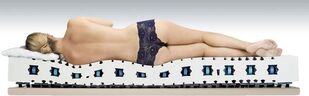 Gentle position of the body on the orthopedic mattress. 